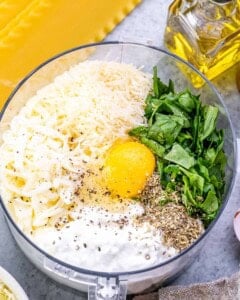 blending together cottage cheese with egg, spinach and cheese to make a creamy sauce