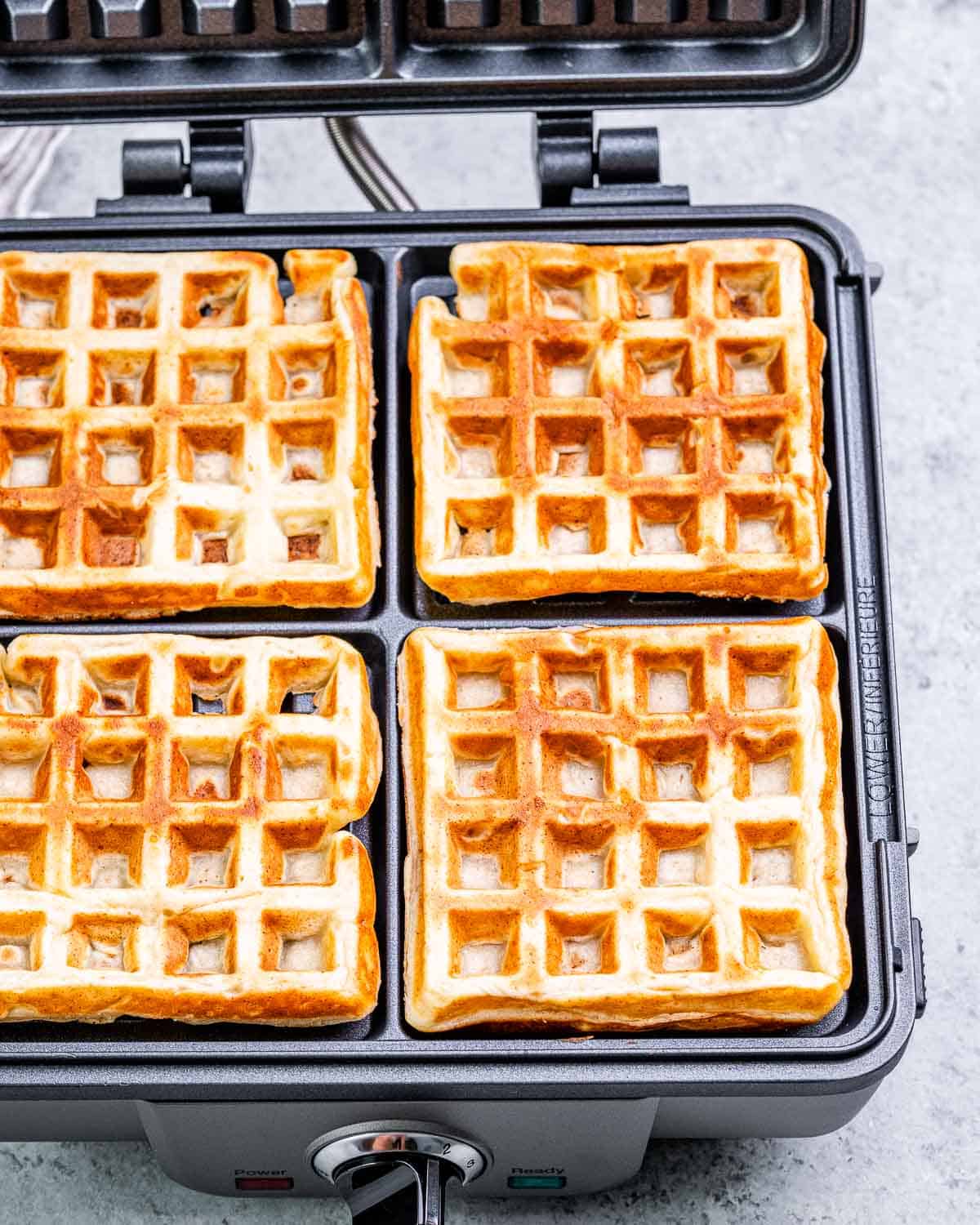 cooked waffles on the waffle maker.