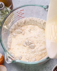 Oat flour and baking ingredients being combined in a mixing bowl.
