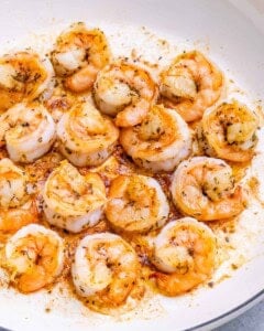Close-up of shrimp coated in seasoning, ready to be cooked.