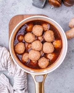 Meatballs in sauce in a pot.