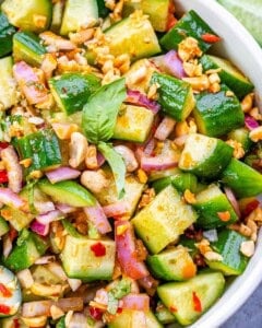 close up of Thai cucumber salad in a white bowl