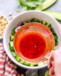 chilli dressing in a small glass jug