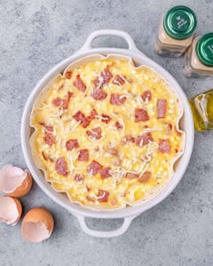 Uncooked egg bake in a white casserole dish before baking.