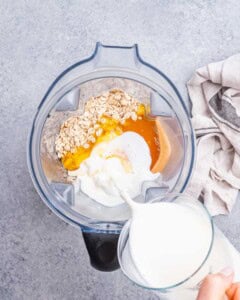 Adding ingredients for blended oats to blender jug