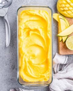 a rectangular bowl with mango sorbet.