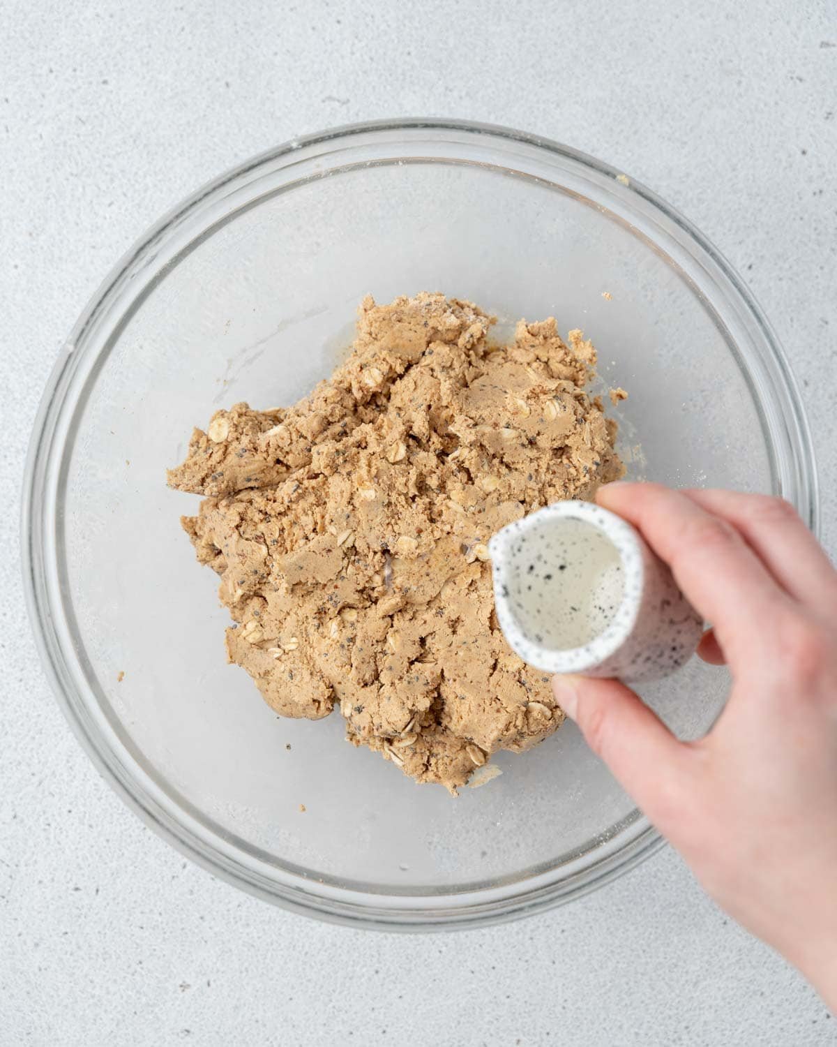 water is being added over the peanut butter oat mix.