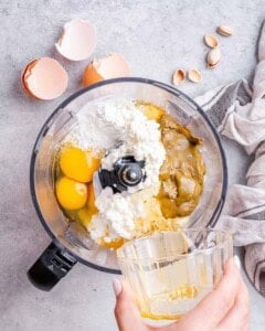 blending together pistachio cheesecake filling ingredients