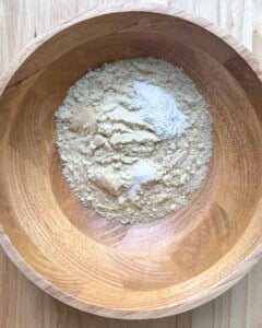 a bowl with almond flour, onion powder, and baking powder.