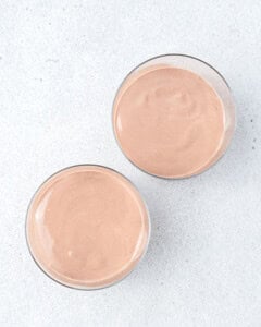 chocolate pudding divided between two cups.