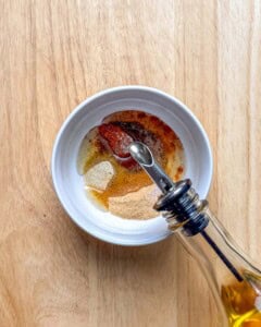 making the seasonings for the potato wedges.