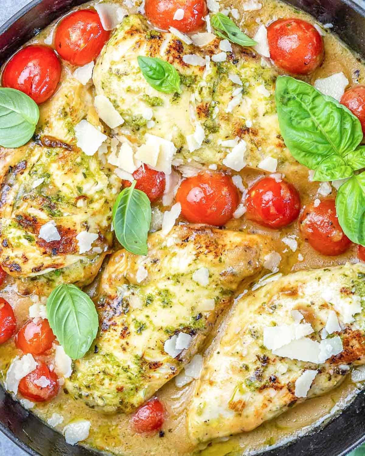 pesto chicken in a creamy sauce cooked with cherry tomatoes.