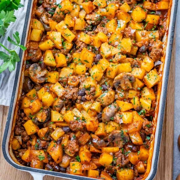 beef and potatoes in a casserole dish.