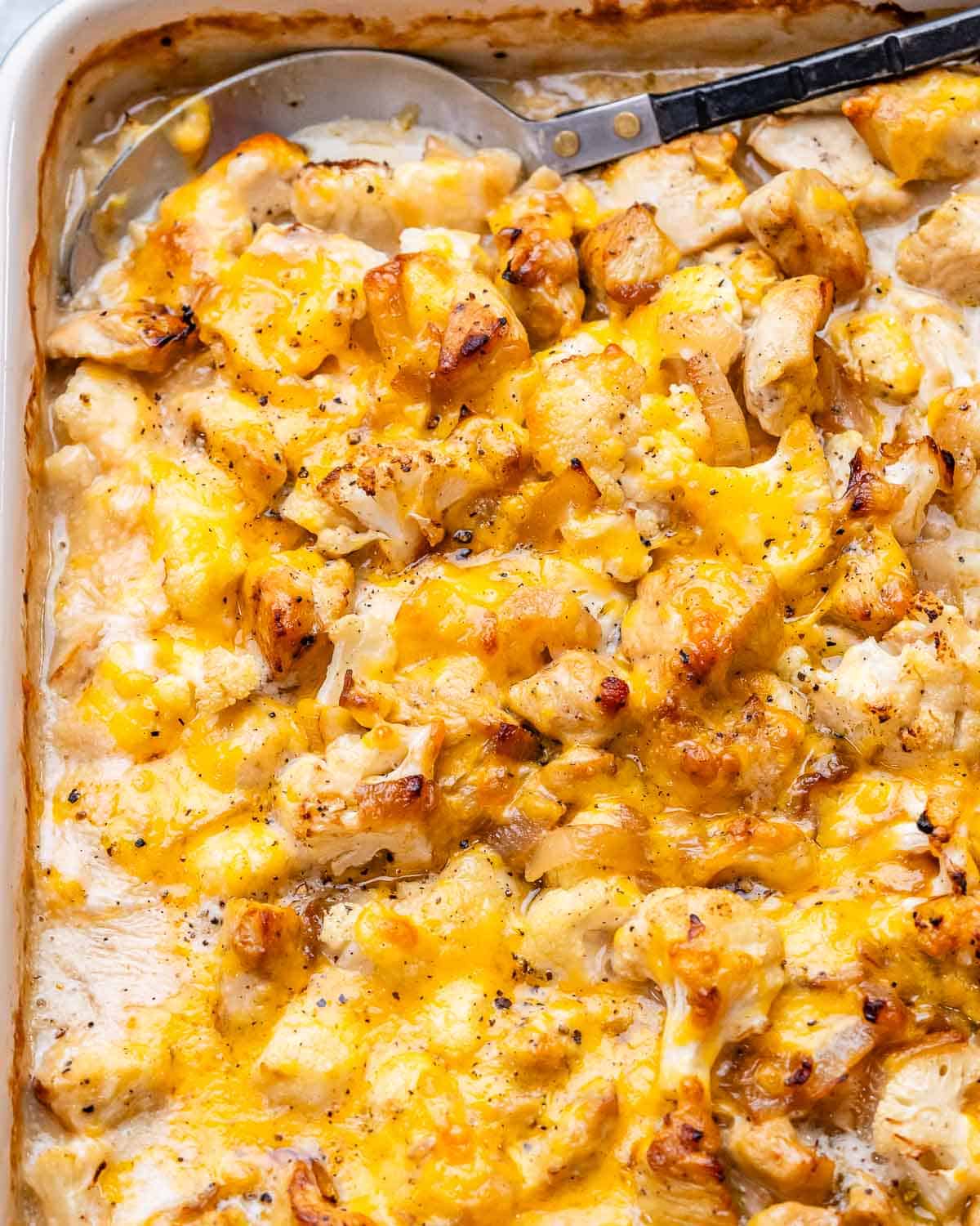 a dish of French onion chicken casserole in a dish with a spoon