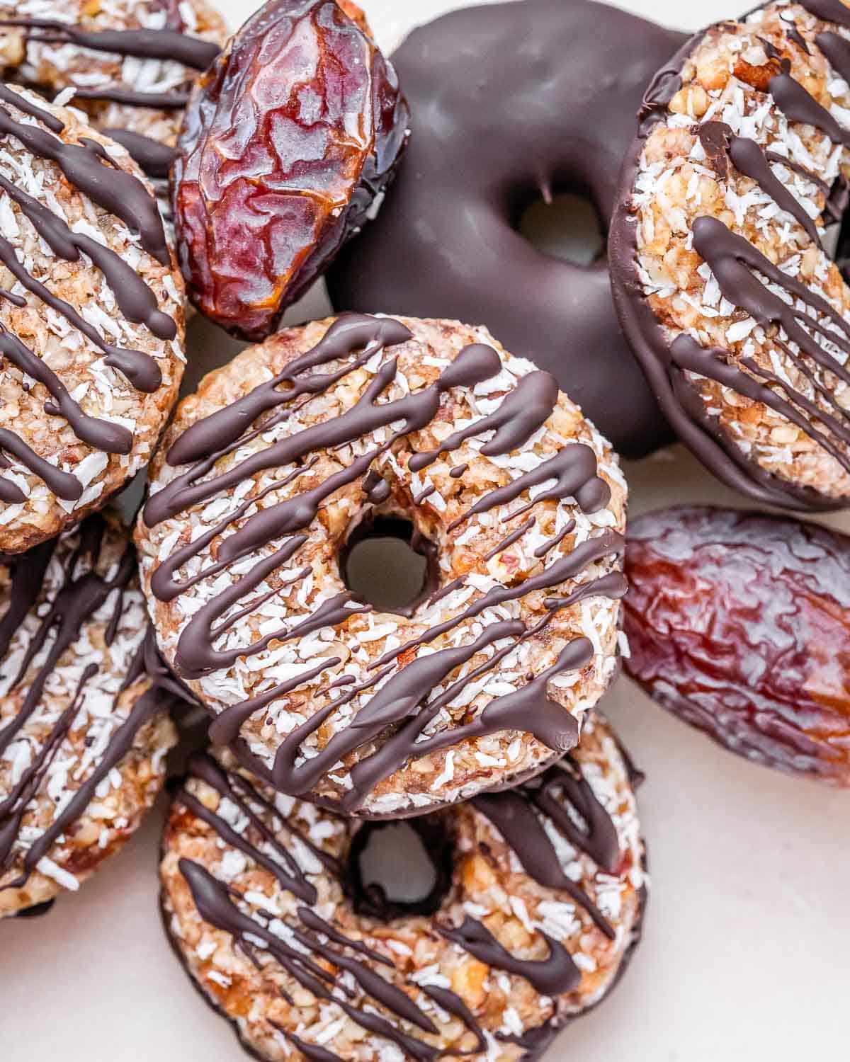 A pile of homemade healthy samoa cookies on a white background