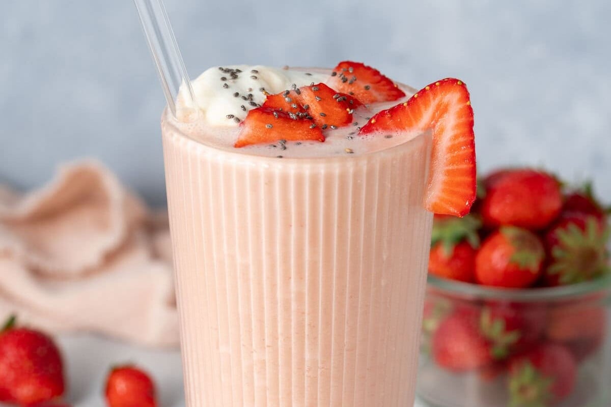 a cup with strawberry shake.