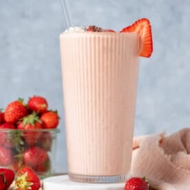a cup with a strawberry shake.