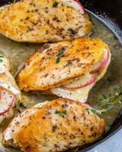 stuffed chicken breasts seared and baked in a pan.