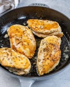 seared chicken breast in a pan.