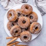 pumpkin donuts on a white plate.