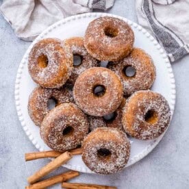 pumpkin donuts on a white plate.