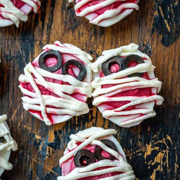 deviled eggs on a cutting board, looking like mummies.