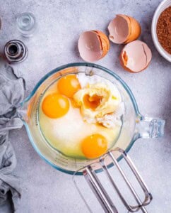 Mixing bowl with butter, sugar, eggs, and coconut oil before beating together for the brownie batter.