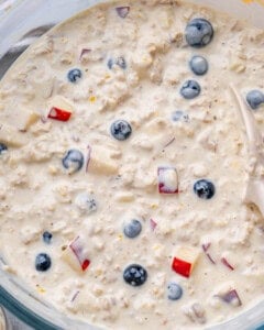 overnight oats ingredients added to a bowl and mixed together.