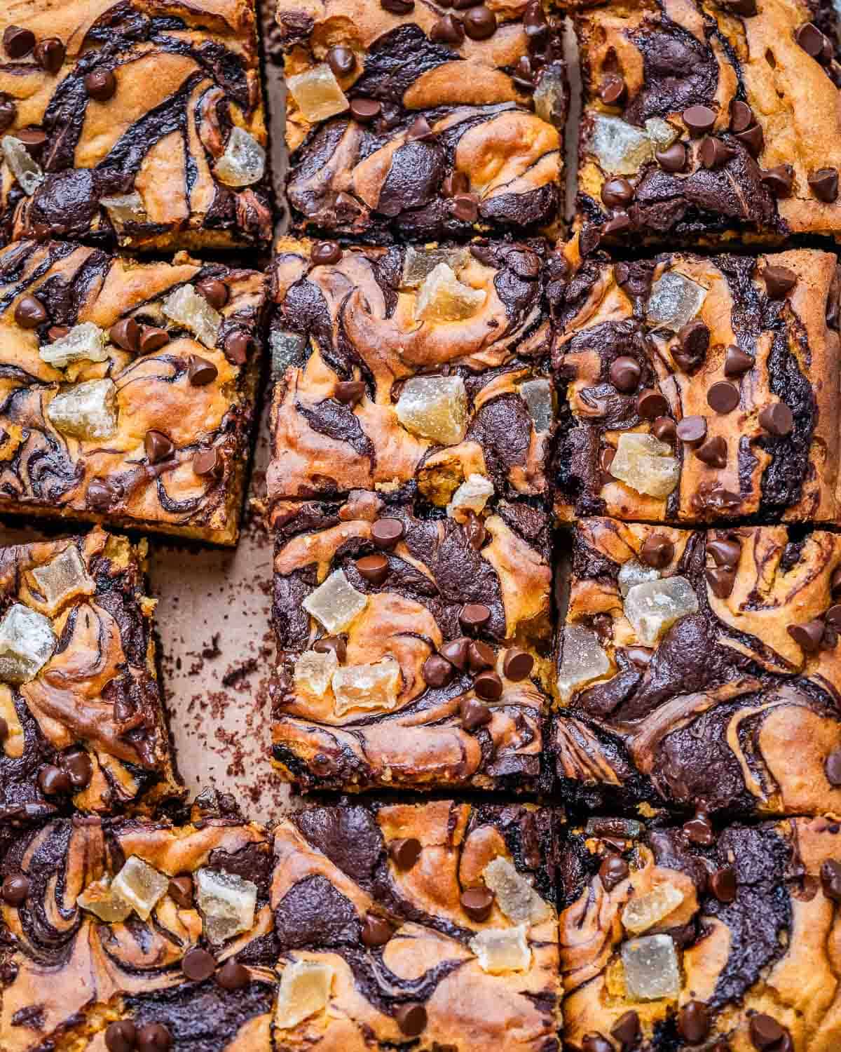 pumpkin brownie square bars on a flat surface.