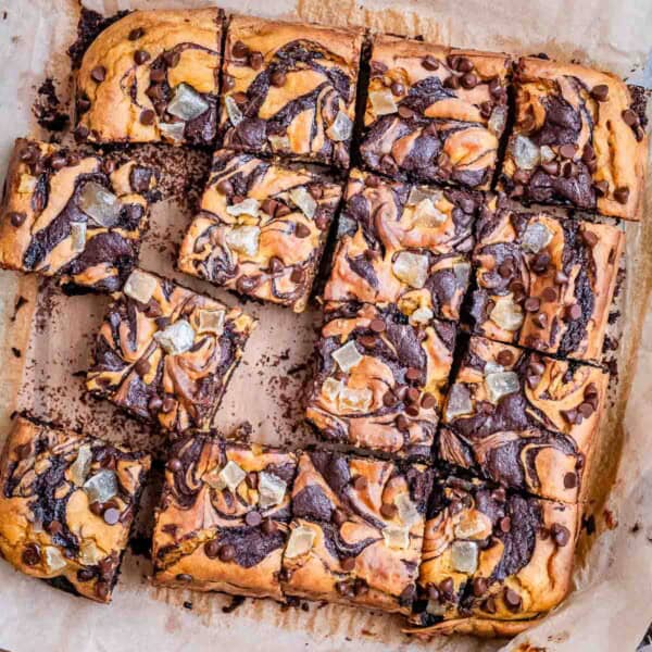 brownie squares on parchment paper made with a pumpkin base.