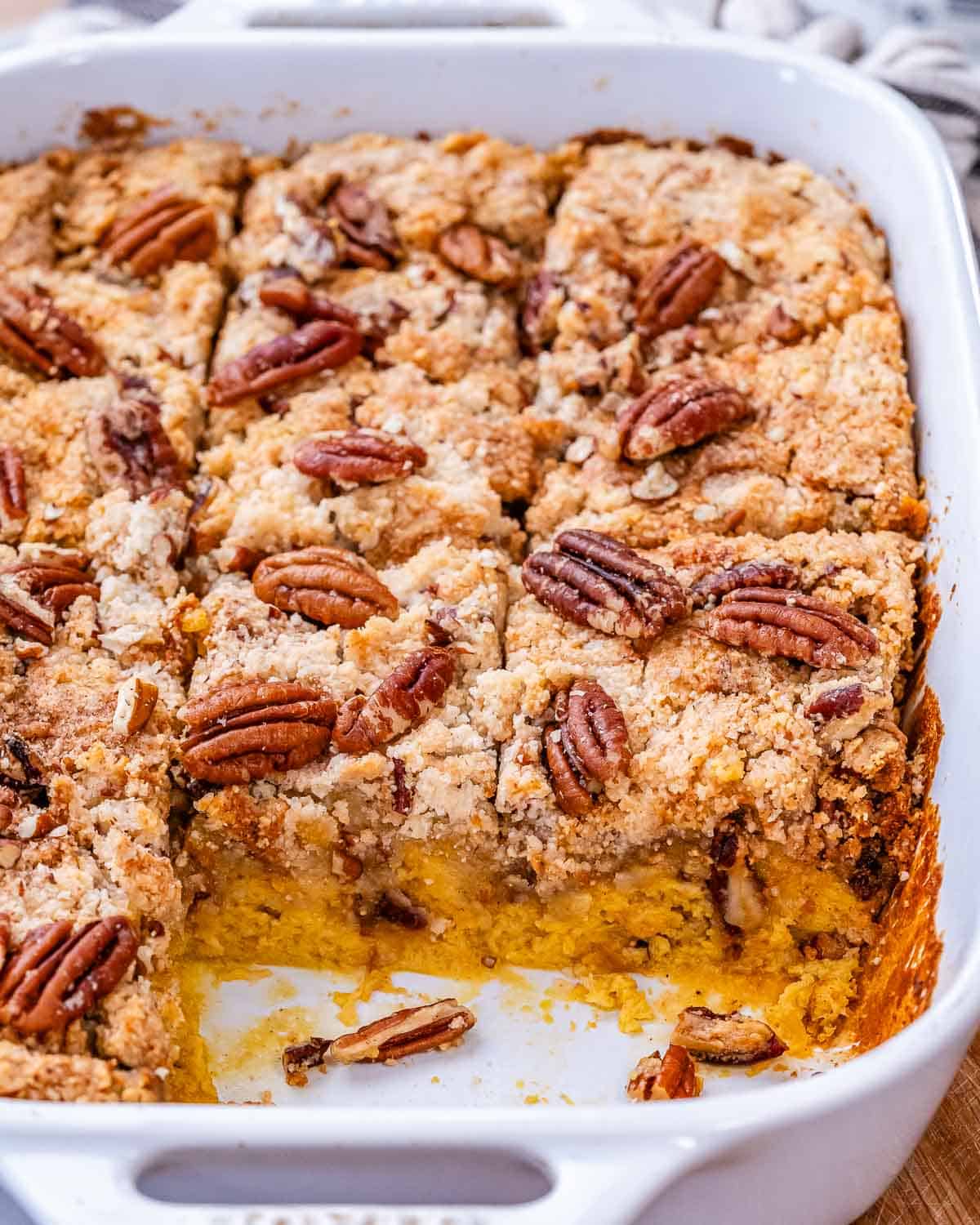 Pumpkin dump cake in a white ceramic baking dish