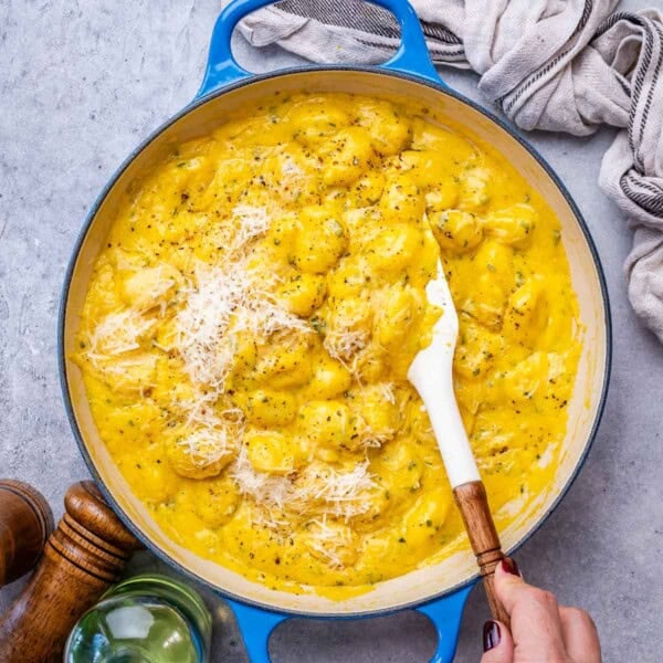 a blue skillet with pumpkin gnocchi.