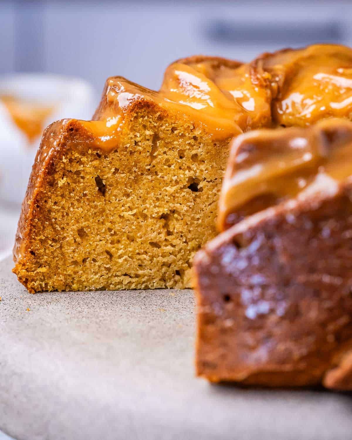 Glazed pumpkin pound cake with a slice taken away