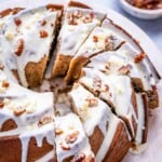 sliced bundt cake made with a sweet potato base, topped with white chocolate glaze.