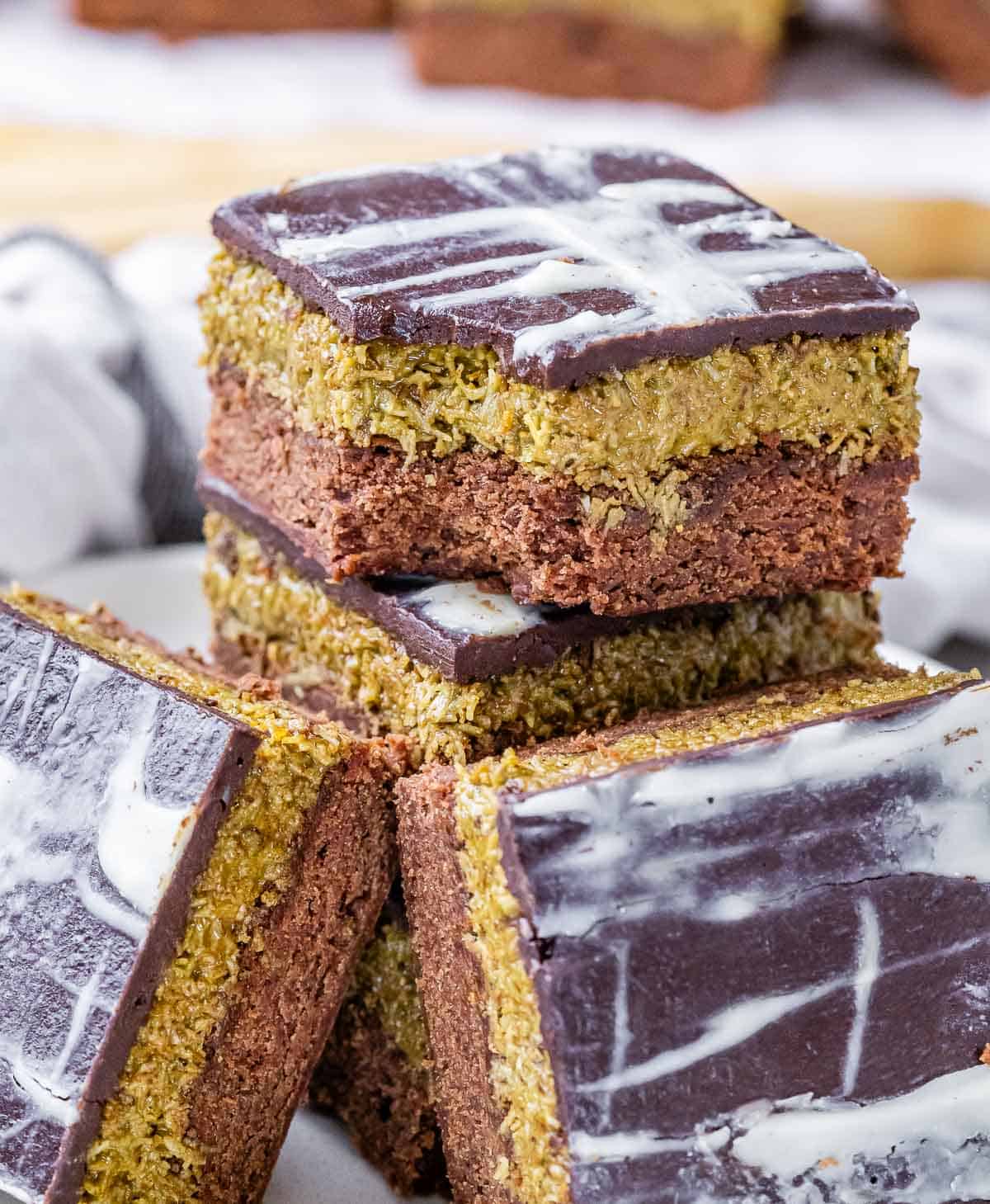 A stack of Dubai brownies, one with a bite taken out.