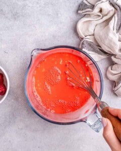 Whisk the Jell-O, water, and the yogurt in a bowl.