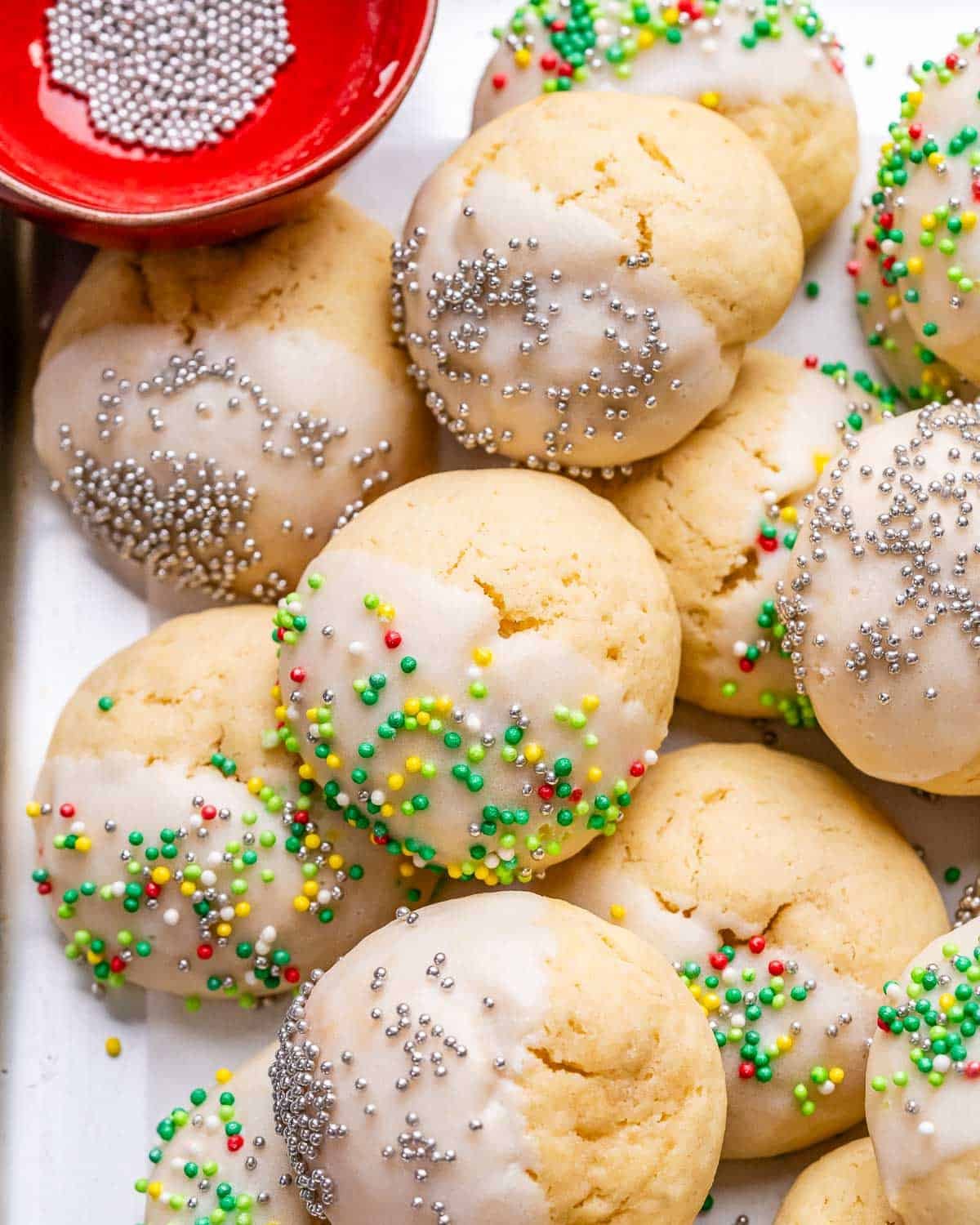 cookies with sprinkles on a sheet pan.