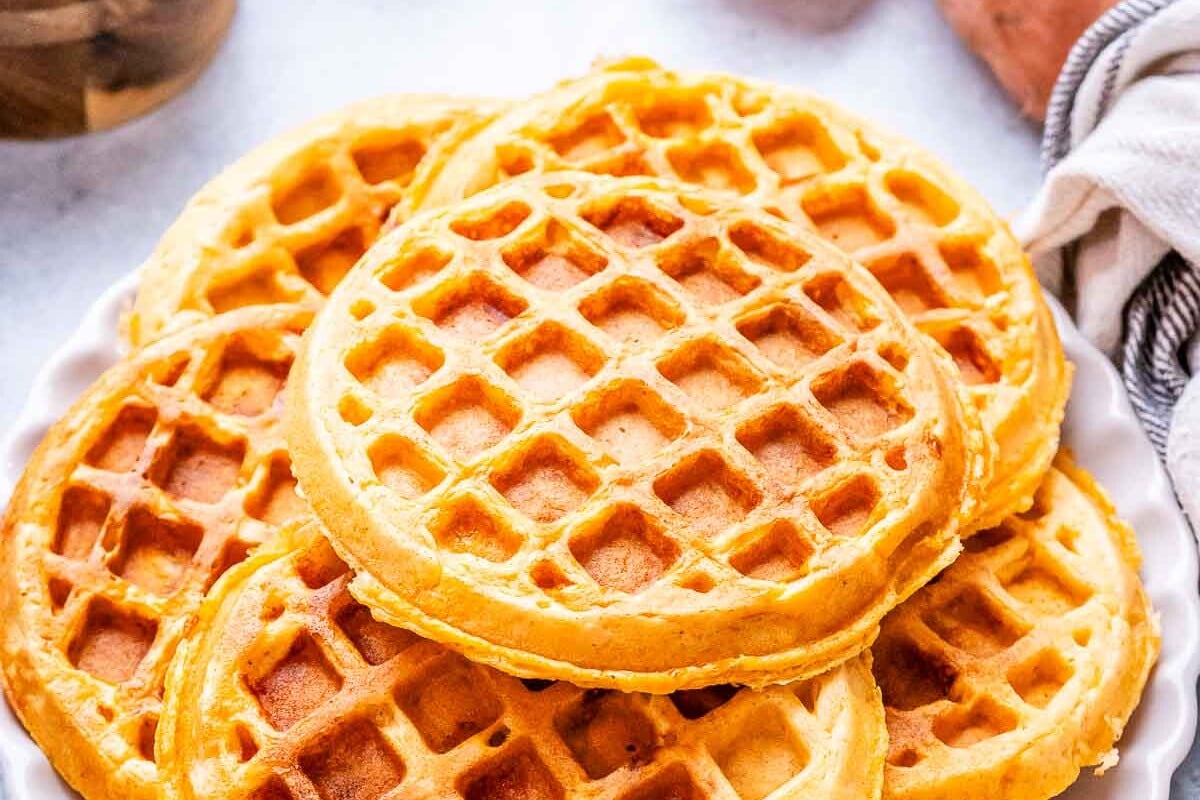 waffles stacked on a plate.