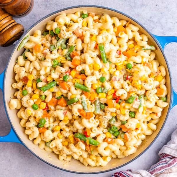 mac and cheese with veggies in a skillet.