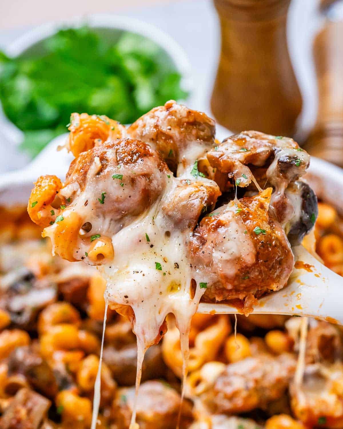 A closeup image of a spoonful of dump and bake meatball casserole