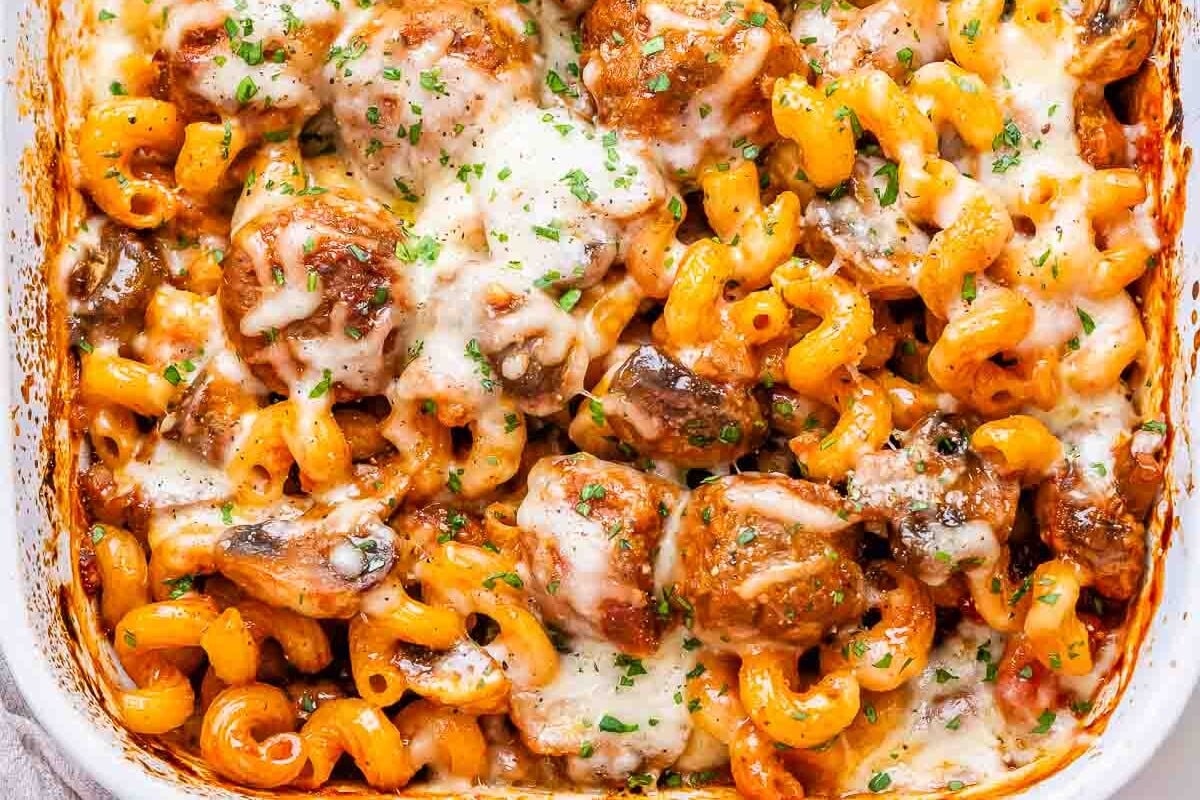 Pasta and meatballs in a dish.