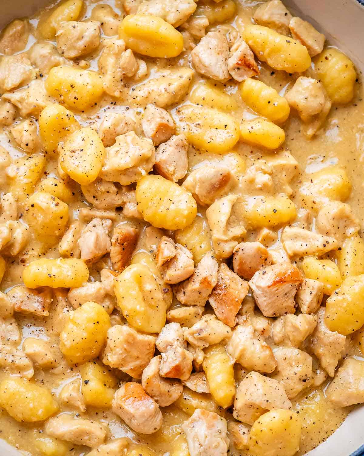 A close up image of one pan gnocchi carbonara in a skillet.