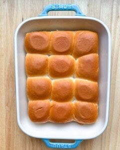 bread rolls placed in a baking dish.