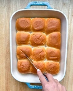 cutting an X into each roll.