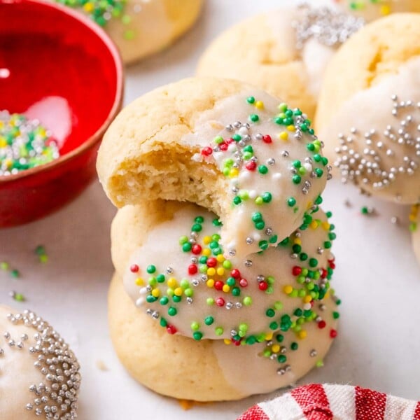 3 cookies stacked over each other with a bite taken off the top cookie.
