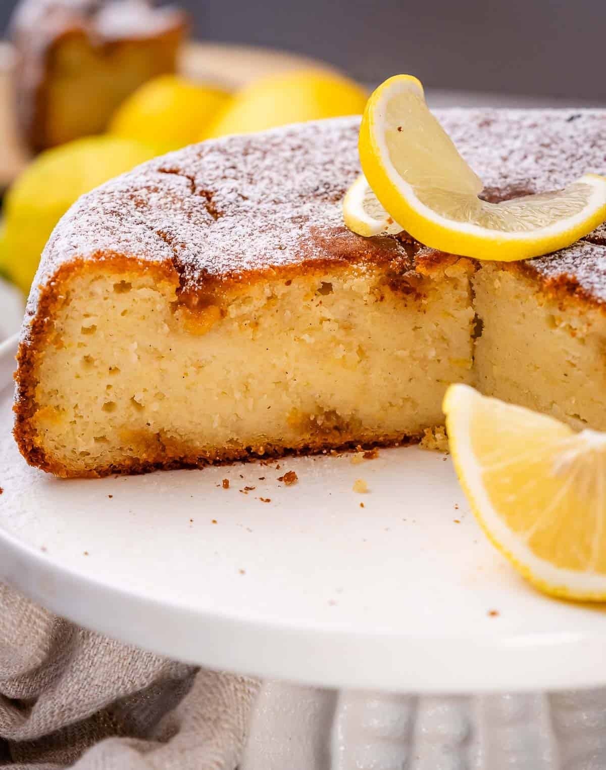 a sliced cake on a cake pedestal.