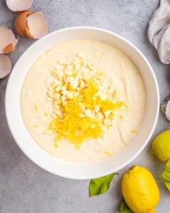 adding in lemon zest and white chocolate chips into the cake batter.