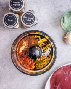 Marinade ingredients are added to a blender.