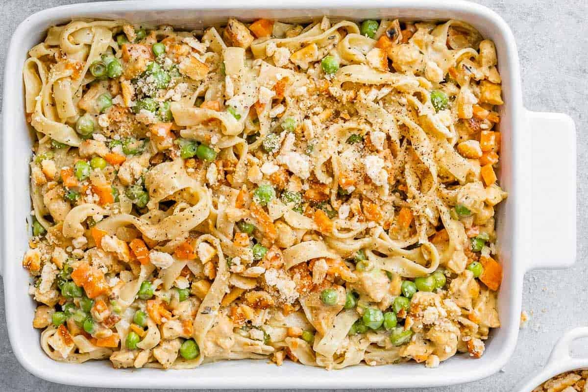 a casserole dish filled with chicken pot pie with pasta.