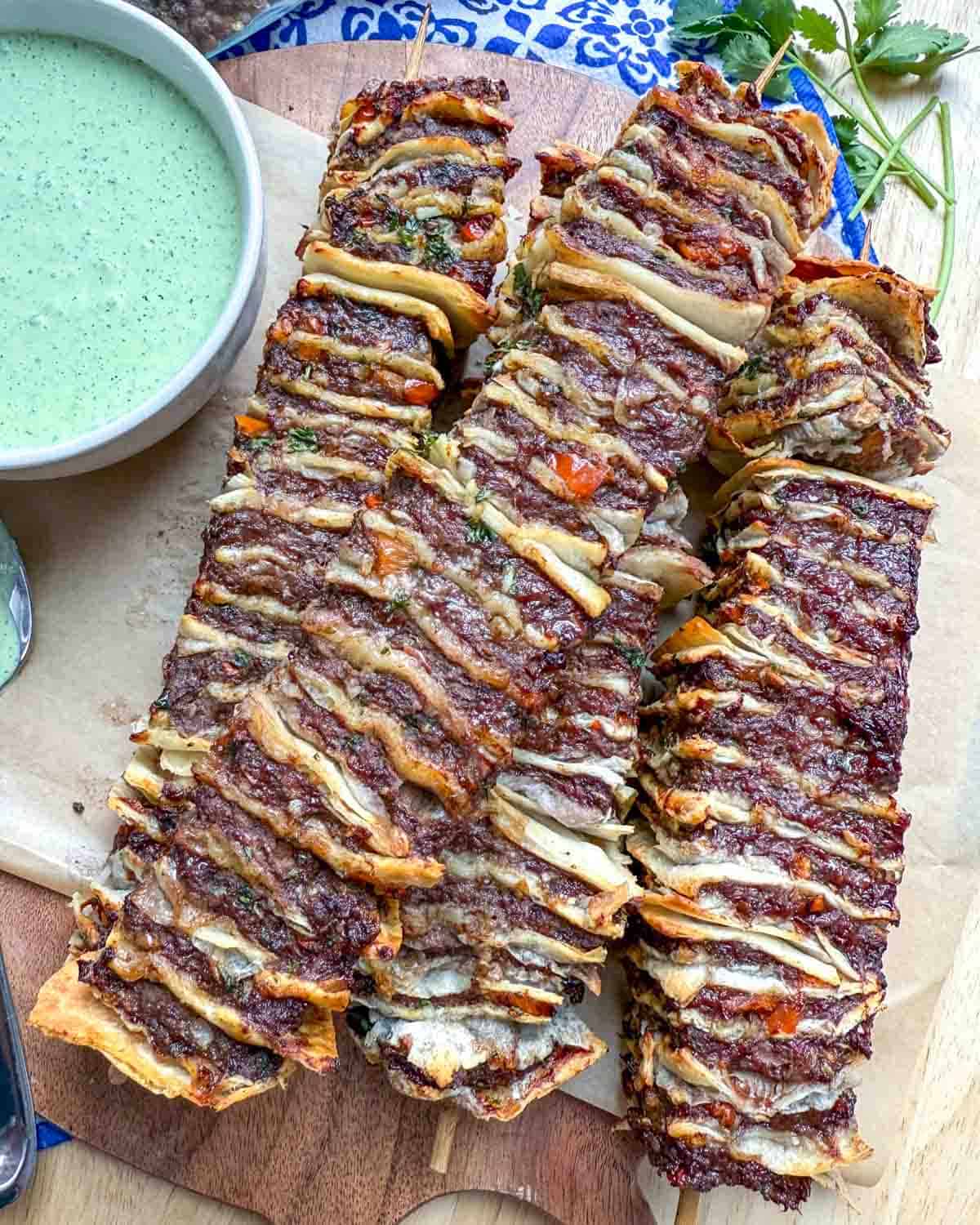 tortilla kebab skewers on a cutting board.